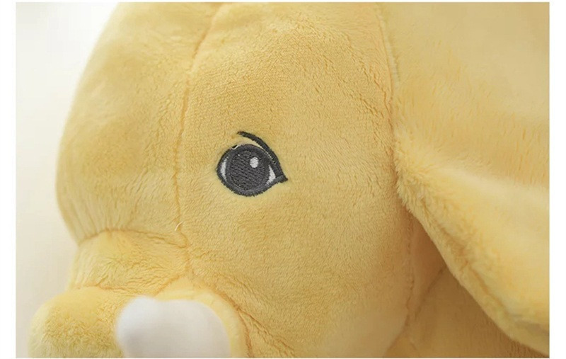 Peluche éléphant jaune - zoom sur le visage