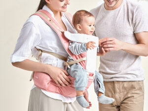 Porte-bébé hipseat couleur rose pour porter bébé plus longtemps